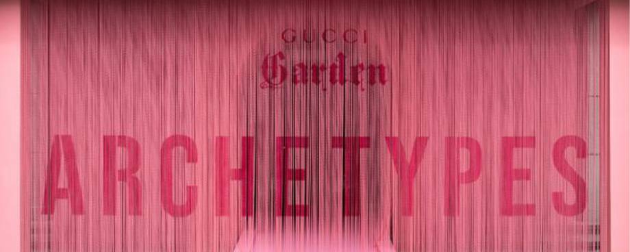 A front picture of Gucci Garden pepto pink chain link curtain.